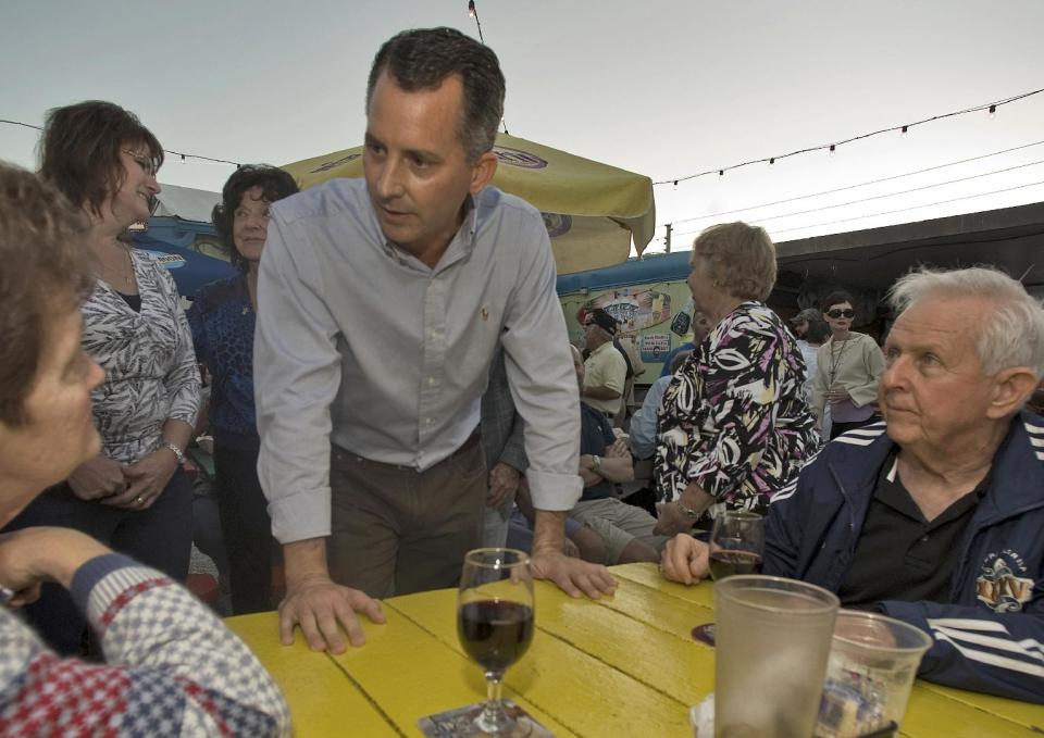 FILE - This Nov. 23, 2013 file photo shows Florida Republican Congressional candidate David Jolly talking with supporters in Indian Rocks Beach, Fla. Need proof outside money is going to matter in this year’s elections? Just look at spending this week. Republicans are sending almost $2 million into a Florida special election for the U.S. House and Democrats are standing by with almost the same amount. (AP Photo/Steve Nesius, File)