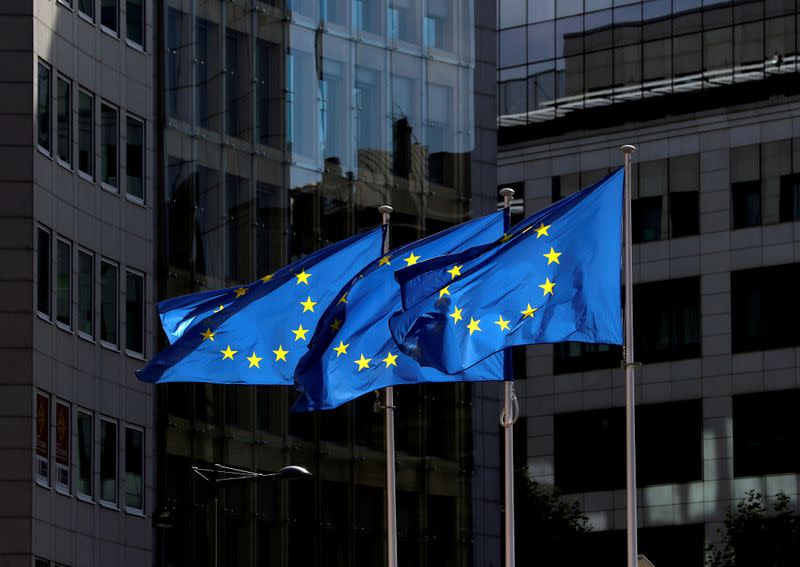 FILE PHOTO: European Union flags flutter outside the European Commission headquarters in Brussels