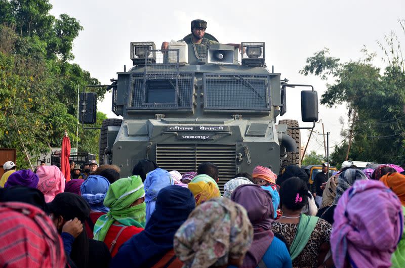 Residents from Meitei community stop an army vehicle, in Imphal