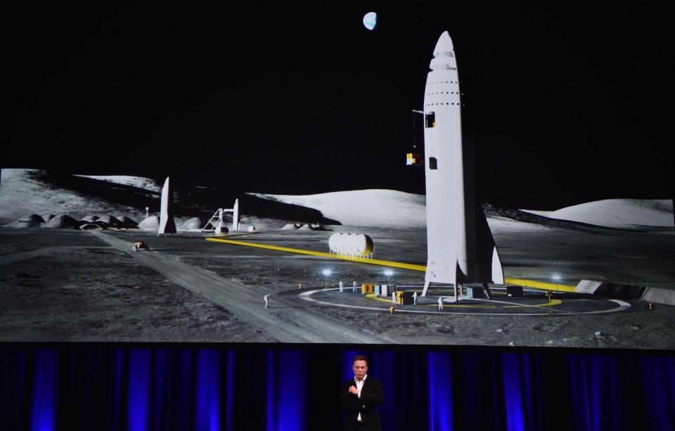 Billionaire entrepreneur and founder of SpaceX Elon Musk speaks below a computer generated illustration of his new rocket at the 68th International Astronautical Congress 2017 in Adelaide on September 29, 2017: PETER PARKS/AFP/Getty Images