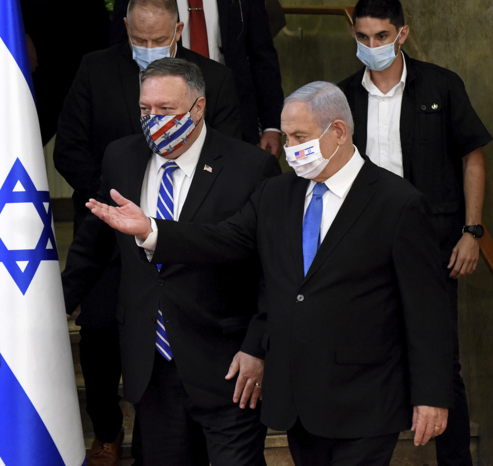 U.S. Secretary of State Mike Pompeo and Israeli Prime Minister Benjamin Netanyahu wear face masks to help prevent the spread of the coronavirus before they make joint statements to the press, in Jerusalem, Monday, Aug. 24, 2020. (Debbie Hill/Pool via AP)