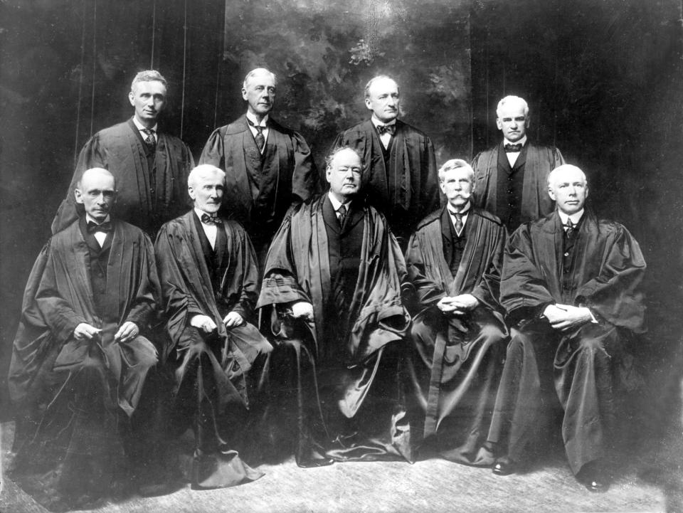 FILE - With the addition of the Supreme Court's newest member, Associate Justice Louis D. Brandeis, top row left, the high court sits for a new group photograph in 1917 in New York. Standing from left are, Associate Justice Louis D. Brandeis, Associate Justice Mahlon Pitney, Associate Justice James C. McReynolds and Associate Justice John H. Clarke. Seated from left are, Associate Justice William R. Day, Associate Justice Joseph McKenna, Chief Justice Edward D. White, Associate Justice Oliver Wendell Holmes, and Associate Justice W. Van Devanter. (AP Photo, File)