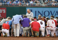 <p>JUN. 15, 2017 – Democrats and Republicans gather at second base for a prayer prior to the start of the Congressional baseball game with the house chaplain leading the way. Members of Congress took the field for their traditional Republicans vs. Democrats baseball game, with many wearing hats to honor Representative Steve Scalise, who was critically wounded by a gunman as his Republican team practiced a day before. (Photo: Jonathan Newton / The Washington Post via Getty Images) </p>