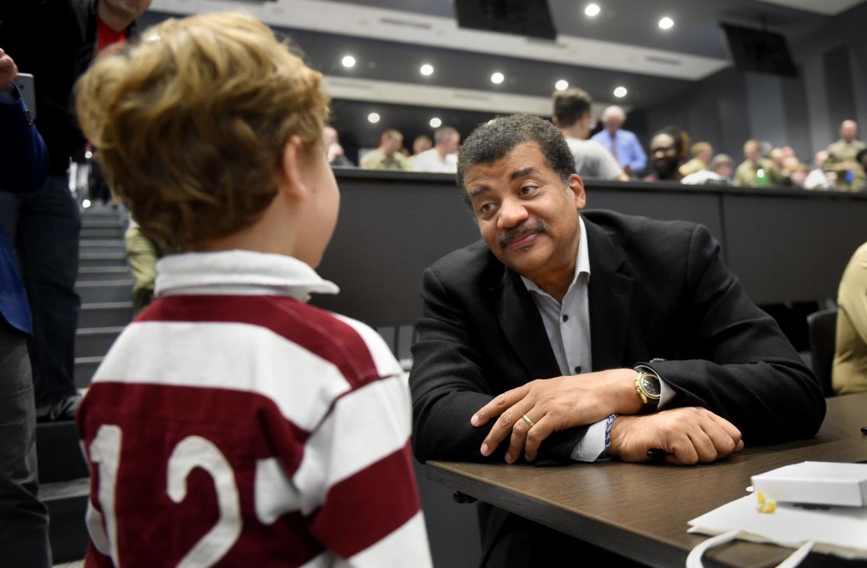 Neil deGrasse Tyson talks with Johnny Weyrick, 5, during a Defense Digital Service event at the Georgia Cyber Center in Augusta, in this photo from 2019. Tyson is scheduled to visit the Columbia County Performing Arts Center in late February 2024.