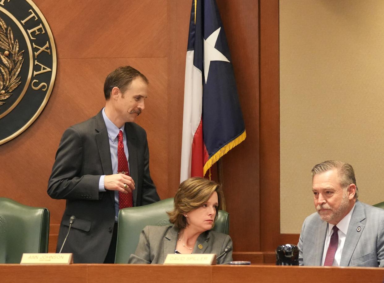 Rep. Andrew Murr, R - Junction, chair of the House General Investigating Committee, and committee members Rep. Ann Johnson, D - Houston, and Rep. David Spiller, R - Jacksboro, prepare to start a hearing about Attorney General Ken Paxton at the Capitol on Wednesday May 24, 2023.