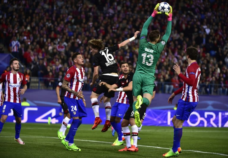 Atletico Madrid's goalkeeper Jan Oblak stops a ball during the UEFA Champions League round of 16 second leg football match against Bayer Leverkusen March 15, 2017