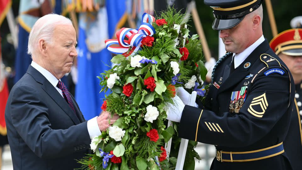 Biden participates in a wreath laying ceremony at the Tomb of the Unknown Soldier on Monday. - Mandel Ngan/AFP/Getty Images