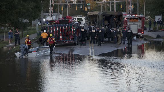 Swift water rescue teams stage in Lumberton, N.C., Monday, Oct. 10, 2016.