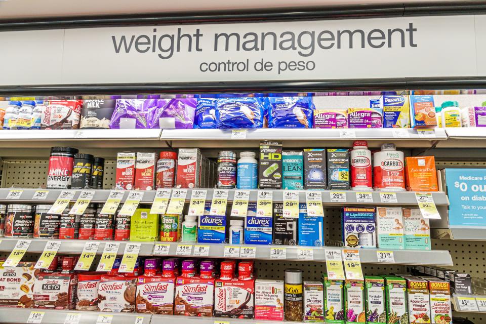 Under the words "Weight Management" a variety of products appear on shelves.