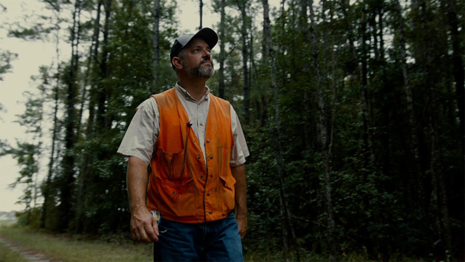 Timber Marketing Manager Casey LaCasse assesses a stand of timber.