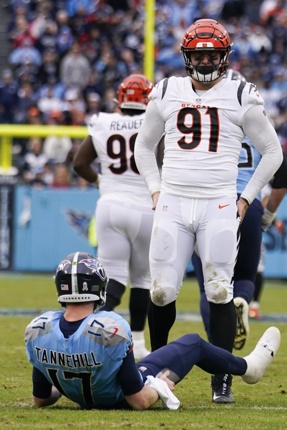 Cincinnati Bengals defensive end Trey Hendrickson (91) stands over Tennessee Titans quarterback Ryan Tannehill (17) after a hit during the second half of an NFL football game, Sunday, Nov. 27, 2022, in Nashville, Tenn. (AP Photo/Gerald Herbert)