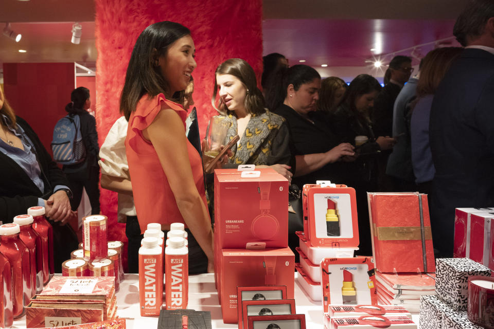 People browse at the opening day of Story, Wednesday, April 10, 2019, at Macy's in New York. Story, which curates merchandise around a theme and rotates every four to six weeks, comes at a time when department stores are trying to rethink how to better excite shoppers who are increasingly going online. (AP Photo/Mark Lennihan)