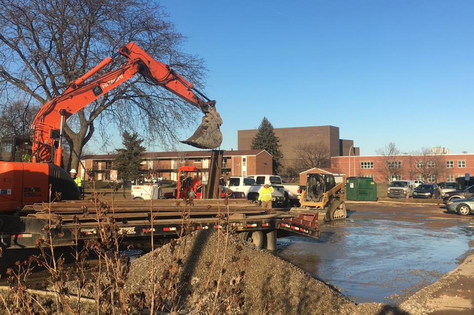 Crews work to repair a broken water main near Larned and McDougall in Detroit on Sunday, January 13, 2018.