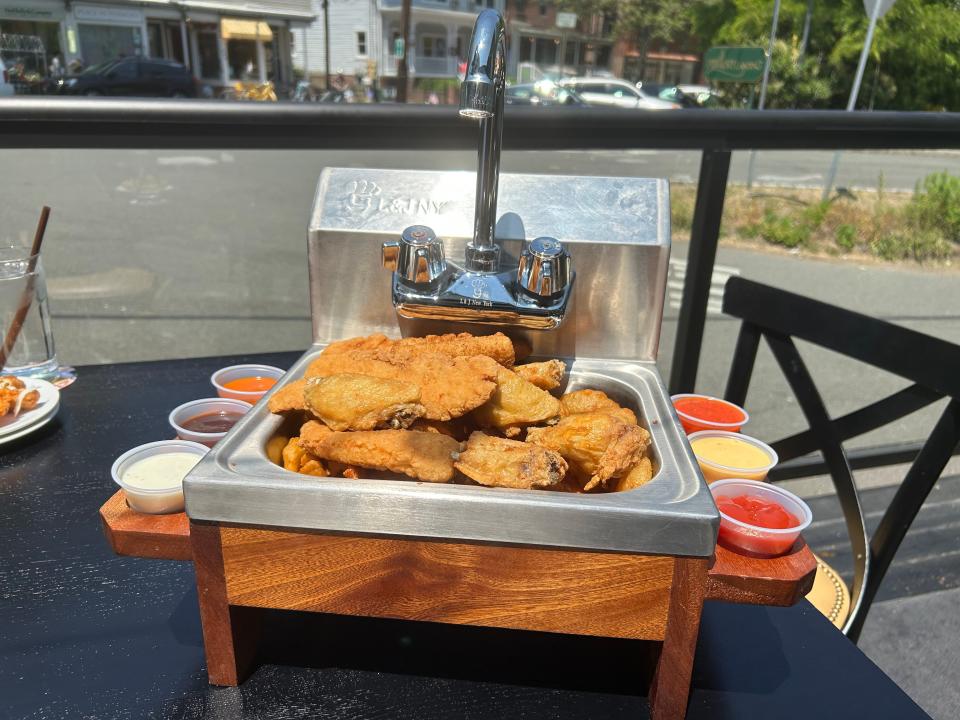 The "Everything But The Kitchen Sink" filled with chicken wings, chicken tenders, mozzarella sticks, waffle fries and onion rings at Reilly's Public House in Piermont. Photographed June 1, 2023