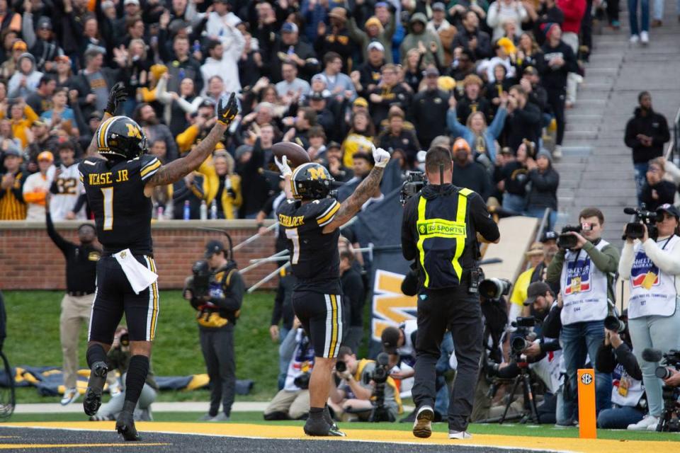Missouri Tigers receiver Theo Wease Jr., left, and running back Cody Schrader celebrate Schrader’s first-half touchdown on Saturday against Tennessee at Faurot Field.