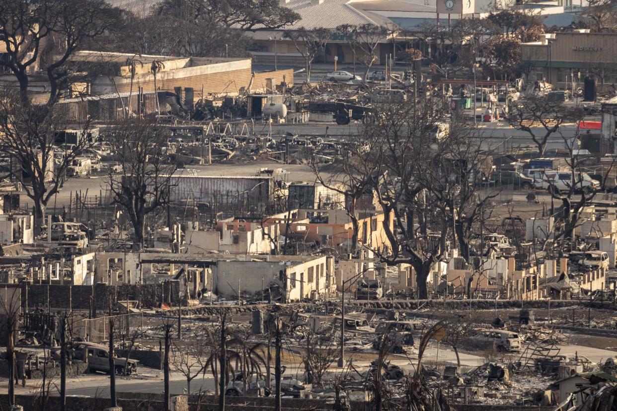 Charred remains of a burned neighbourhood is seen in the aftermath of a wildfire, in Lahaina, western Maui, Hawaii on August 14 (AFP via Getty Images)