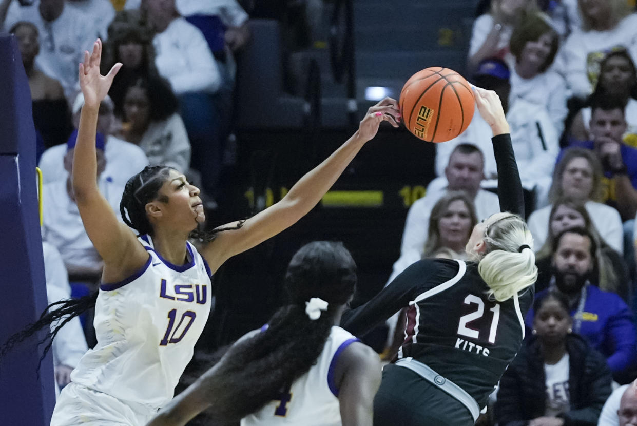 LSU forward Angel Reese (10) blocks a shot by South Carolina forward Chloe Kitts (21) in the first half an NCAA college basketball game in Baton Rouge, La., Thursday, Jan. 25, 2024. (AP Photo/Gerald Herbert)