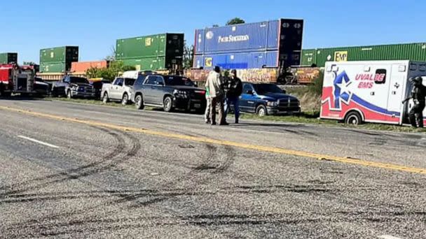 PHOTO: In this March 24, 2023, law enforcement and medical personnel gathered next to a stopped train near Knippa, Texas. (Emmanuel Zamora/Uvalde County Constable via AFP via Getty Images)