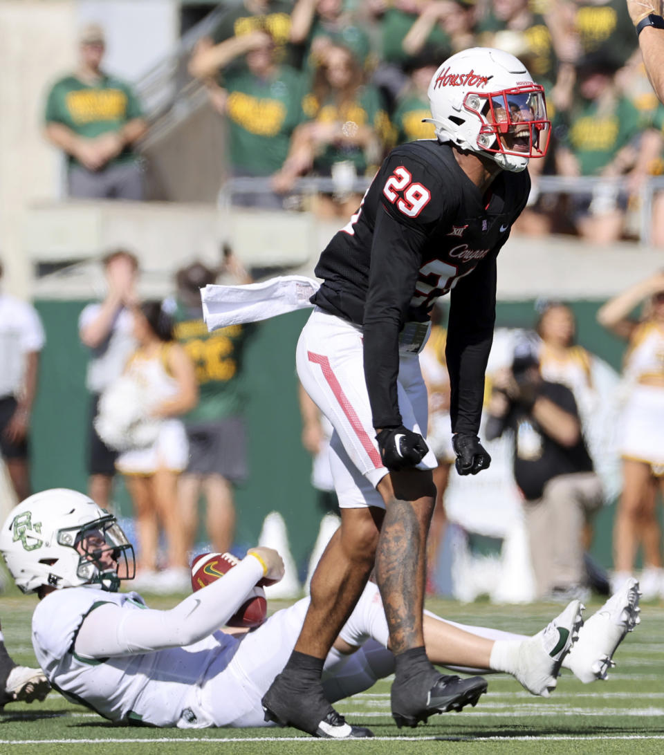 Houston linebacker Treylin Payne (29) reacts after sacking Baylor quarterback Blake Shapen in the first half of an NCAA college football game, Saturday, Nov. 4, 2023, in Waco, Texas. (Jerry Larson/Waco Tribune-Herald via AP)