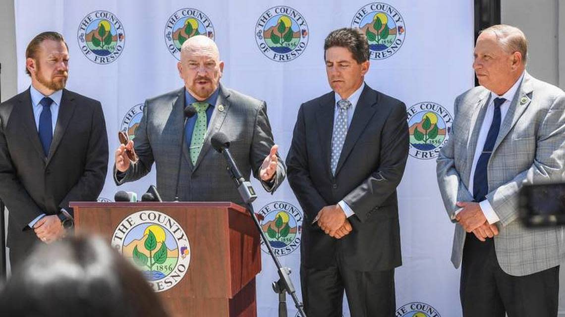 Fresno County Supervisor Steve Brandau speaks at an August 2021 news conference flanked by fell board members, from left, Nathan Magsig, Brian Pacheco and Buddy Mendes.