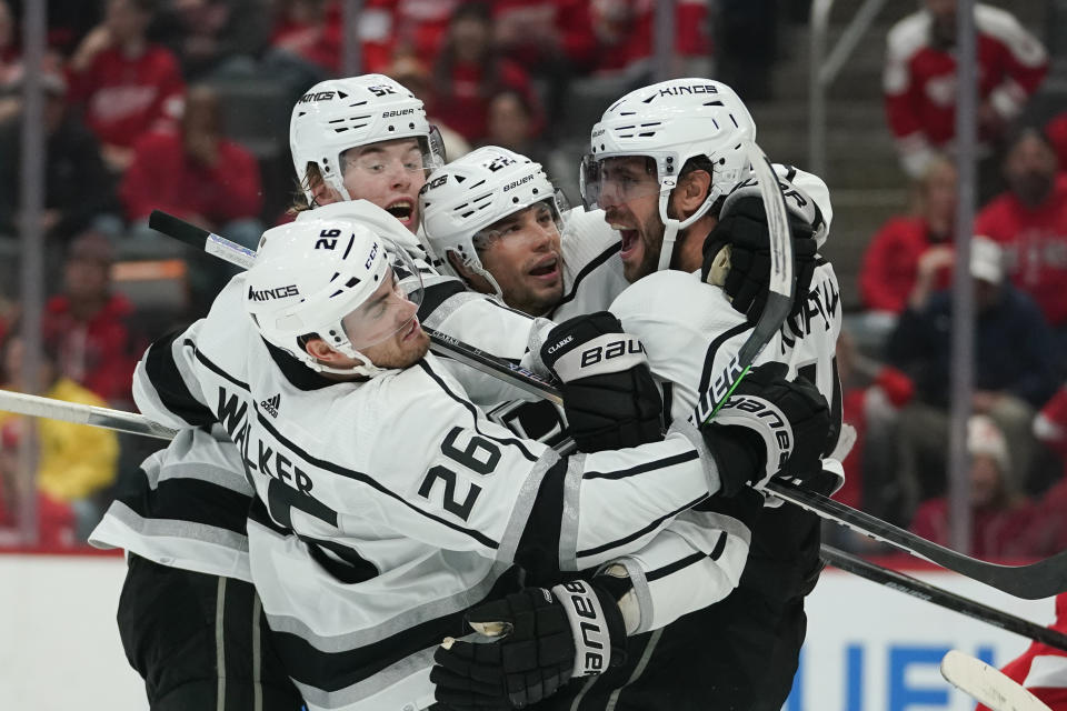 Los Angeles Kings center Anze Kopitar, right, celebrates his goal against the Detroit Red Wings in the third period of an NHL hockey game Monday, Oct. 17, 2022, in Detroit. (AP Photo/Paul Sancya)