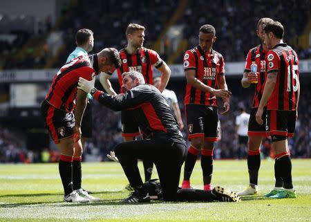 Britain Soccer Football - Tottenham Hotspur v AFC Bournemouth - Premier League - White Hart Lane - 15/4/17 Bournemouth's Jack Wilshere receives medical attention after sustaining an injury Action Images via Reuters / Paul Childs Livepic