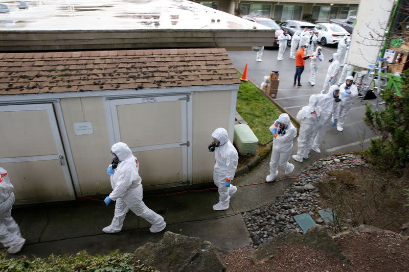 Cleanup crews at the Life Care Center of Kirkland in Washington