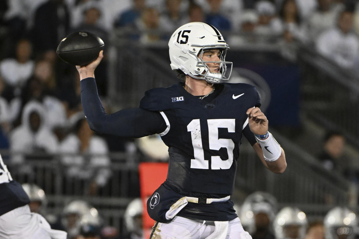 Penn State quarterback Drew Allar (15) throws a pass against Illinois during the first half of an NCAA college football game, Saturday, Sept. 28, 2024, in State College, Pa. (AP Photo/Barry Reeger)