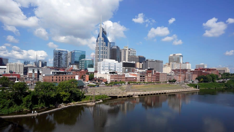 <em>The Nashville, Tenn., skyline is reflected in the Cumberland River on July 11, 2022.</em> (AP Photo/Mark Humphrey)