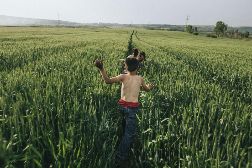 <p>Children run in the wheat field and enjoy nice weather during the local traditional spring festival, Kirklareli, Turkey, 2017. “The cold winter leaves the Thrace region of Turkey and welcomes spring with its shining sun and warm winds. People connect again to nature by celebrating it every year during the first week of May in Kirklareli. When I shot this photo, I was running in the wheat field and enjoying the nice weather, remembering my childhood memories with these kids. For them, as for me, it was a moment of pure freedom.” (© Emin Özmen/Magnum Photos) </p>