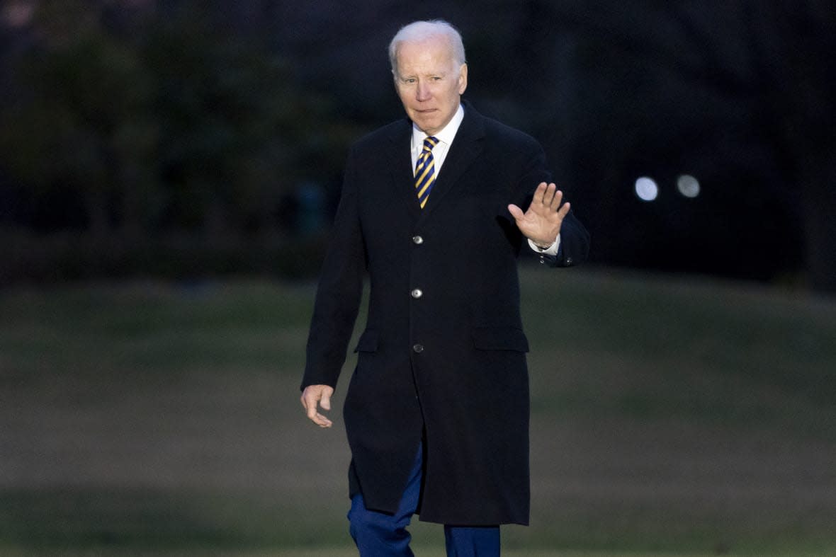 President Joe Biden walks across the South Lawn of the White House in Washington, Tuesday, Jan. 31, 2023, after returning from New York. (AP Photo/Andrew Harnik)
