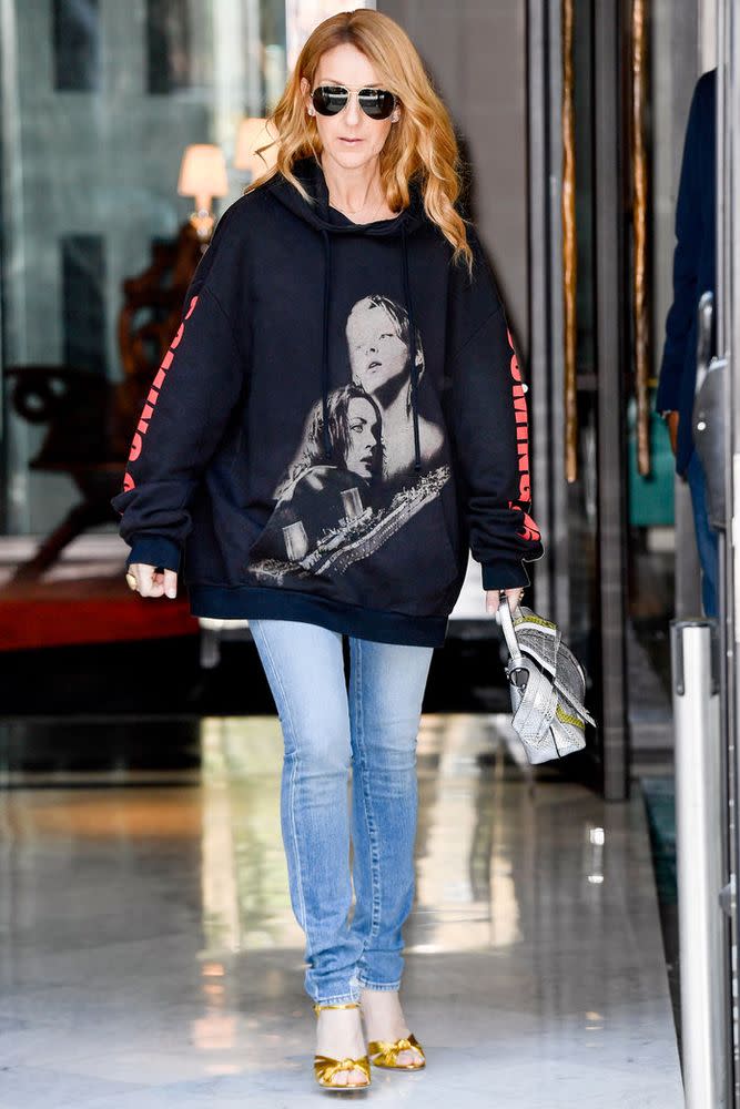 <p>Although Roach was afraid to bring this <em>Titanic </em>Vetements sweatshirt to Dion because he though she would find it cheesy, the risk paid off. The effortless hoodie and denim outfit was the catalyst that brought all of the attention to Dion's new style. </p>

<p>While Roach says that he doesn't think Dion plays favorites when it comes to her outfits, he does belive that she favors low-key denim moments like this one. "She probably loves the jeans and t-shirt moments more than anything, honestly," he says. "To her determent, a lot of people thought that Celine was older than she was because the way she came out and being in Vegas, she was always so 'madame'. I don’t want to be mean to someone else’s work, but the way she dressed kind of made her seem way older than she was. When I first told people I was starting to work with her they would always ask if she was 60. I’m like, “No, she’s 49; she’s younger than Halle Berry”. I think that it was because of how she dressed that the world perceived her as a bit older, and the fact that she’s been singing for 30 years. It was my personal mission to let people see her in a different way because she’s a young, beautiful woman who’s just so vivacious and full of life. It was my goal to use fashion to show the world that, and I think it kind of worked." </p>
 | Splash News