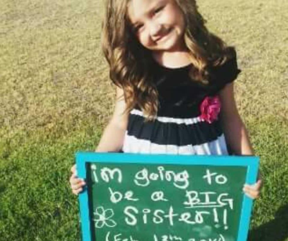 She took a picture of Brooke standing in the garden with a sign that read ‘I’m going to be a big sister” in her hands and posted it straight to Facebook. Photo: Kelsey Davis