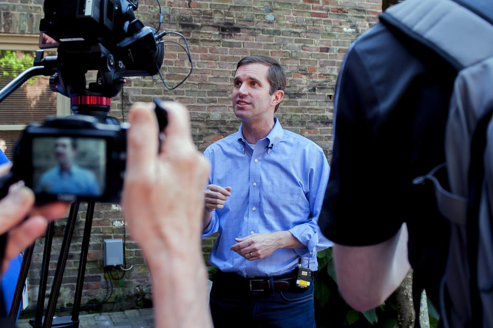 Kentucky attorney general and Democratic gubernatorial candidate Andy Beshear talks with reporters during a campaign stop at Spencer's Coffee, Friday, May 17, 2019 in Bowling Green, Ky. (Bac Totrong/Daily News via AP)