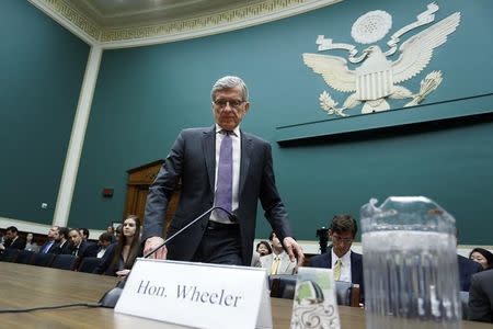 U.S. Federal Communications Commission Chairman Tom Wheeler takes his seat to testify before a House Energy and Commerce Communications and Technology Subcommittee hearing on oversight of the FCC on Capitol Hill in Washington May 20, 2014. REUTERS/Jonathan Ernst