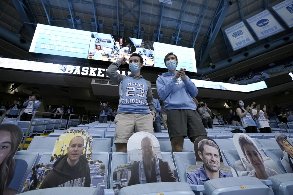 Fans return to the Dean E. Smith Center for an NCAA college basketball game between North Carolina and Florida State in Chapel Hill, N.C., Saturday, Feb. 27, 2021. A limited number of fans were permitted as the state eases restrictions that were in place due to the coronavirus. (AP Photo/Gerry Broome)