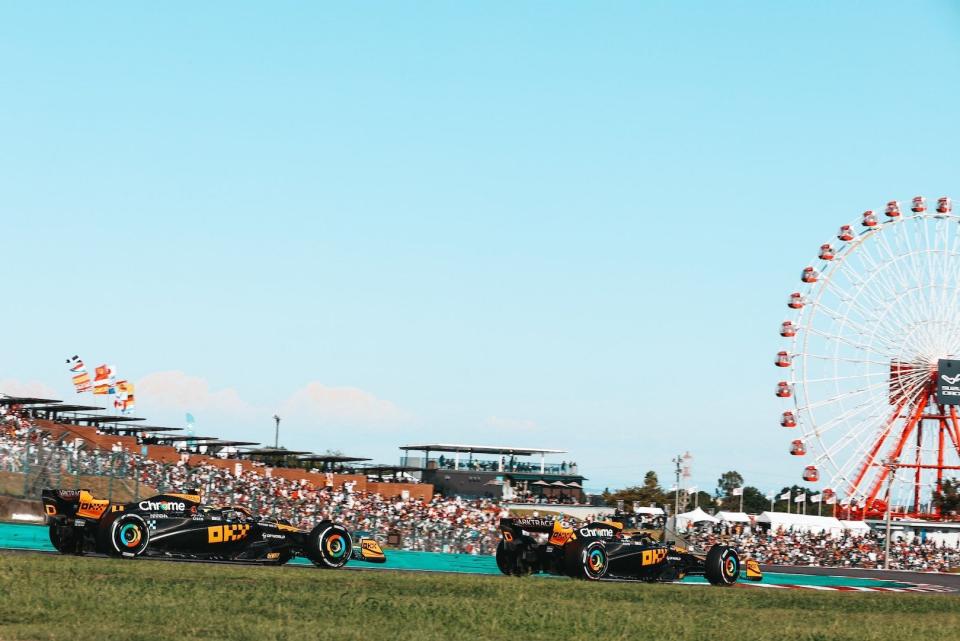 2023 McLaren MCL60s racing at the Japanese Grand Prix