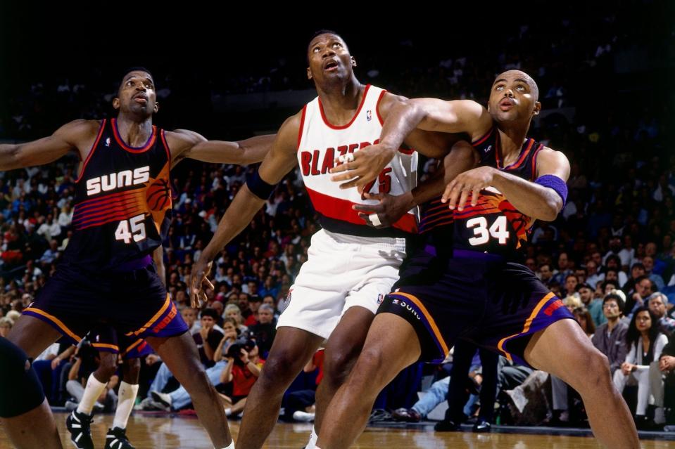 Jerome Kersey (center) battles A.C. Green (left) and Charles Barkley for rebounding position during the 1995 Western Conference Quarterfinals. (Andrew D. Bernstein/NBAE/Getty Images)