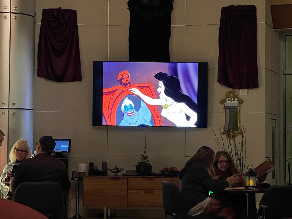 little mermaid playing on a TV in villan's lounge at disney's contemporary resort