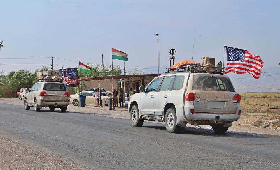 A U.S. military convoy arrives near Dahuk, Iraqi, Monday, Oct. 21, 2019. Defense Secretary Mark Esper said Monday that under the current plan all U.S. troops leaving Syria will go to western Iraq and the military will continue to conduct operations against the Islamic State group to prevent its resurgence. (AP Photo)