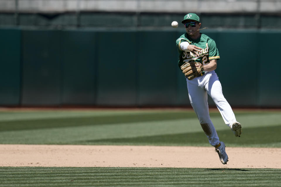 Oakland Athletics shortstop Nick Allen throws to first for an out on Texas Rangers' Leody Taveras during the sixth inning of a baseball game Wednesday, Aug. 9, 2023, in Oakland, Calif. (AP Photo/Godofredo A. Vásquez)