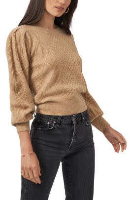 A cozy cable sweater with ever-so-slightly dramatic puff sleeves