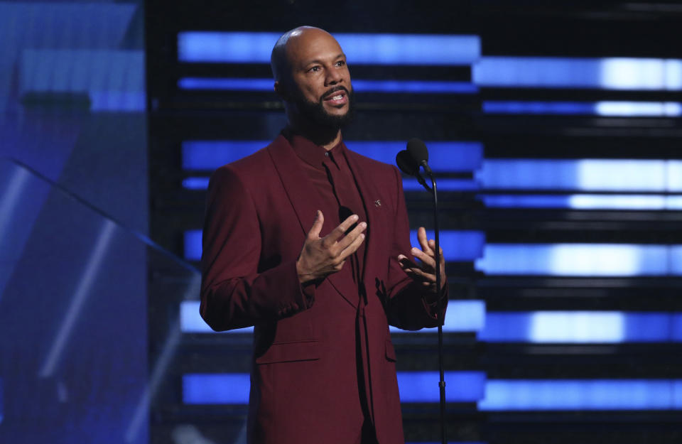 FILE - In this Jan. 26, 2020 file photo, Common introduces a performance at the 62nd annual Grammy Awards in Los Angeles. The Grammy and Academy Award winning rapper and his criminal justice reform organization Imagine Justice has launched a campaign with dozens of advocacy and activist groups calling attention to the threat coronavirus poses on millions of people jailed or imprisoned in the U.S. (Photo by Matt Sayles/Invision/AP, File)