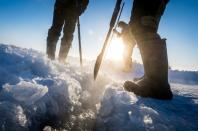 They cut ice blocks out of the lake in temperatures of minus 41 degrees Celsius (minus 42 Fahrenheit)