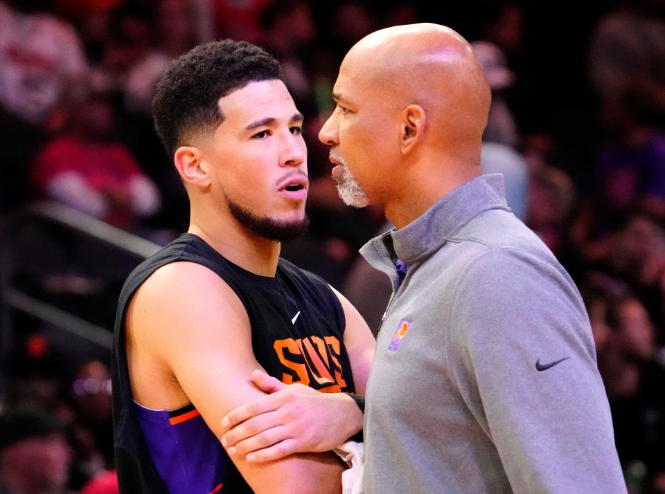 Nov 30, 2022; Phoenix, AZ, USA; Phoenix Suns guard Devin Booker (1) talks to head coach Monty Williams against the Chicago Bulls in the second half at Footprint Center.