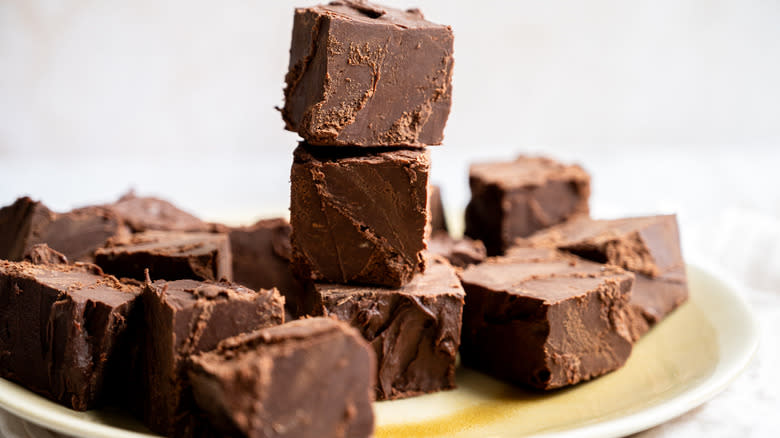 chocolate fudge squares in pile