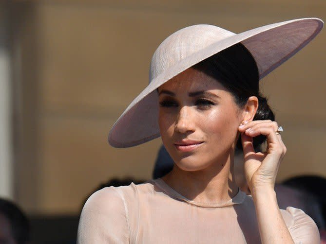 FILE PHOTO: Meghan, Duchess of Sussex attends a garden party at Buckingham Palace, in London, Britain May 22, 2018.  Dominic Lipinski/Pool via Reuters