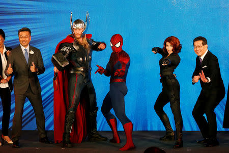 (L-R) Hong Kong Disneyland Resort Executive Vice President and Managing Director Samuel Lau, Marvel characters Thor, Spider-Man, Black Widow and Hong Kong Secretary for Commerce and Economic Development Gregory So pose during a presentation on Hong Kong Disneyland's resort expansion and development plan in Hong Kong, China November 22, 2016. REUTERS/Bobby Yip