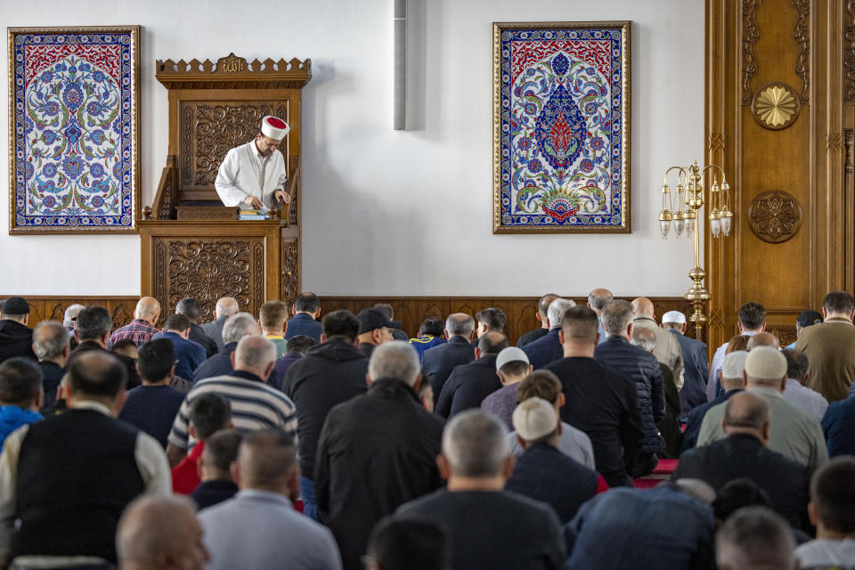 Muslims take part in Friday prayers at the Merkez DITIB mosque in Duisburg, Germany, Friday, Oct. 13, 2023. (Christoph Reichwein/dpa via AP)