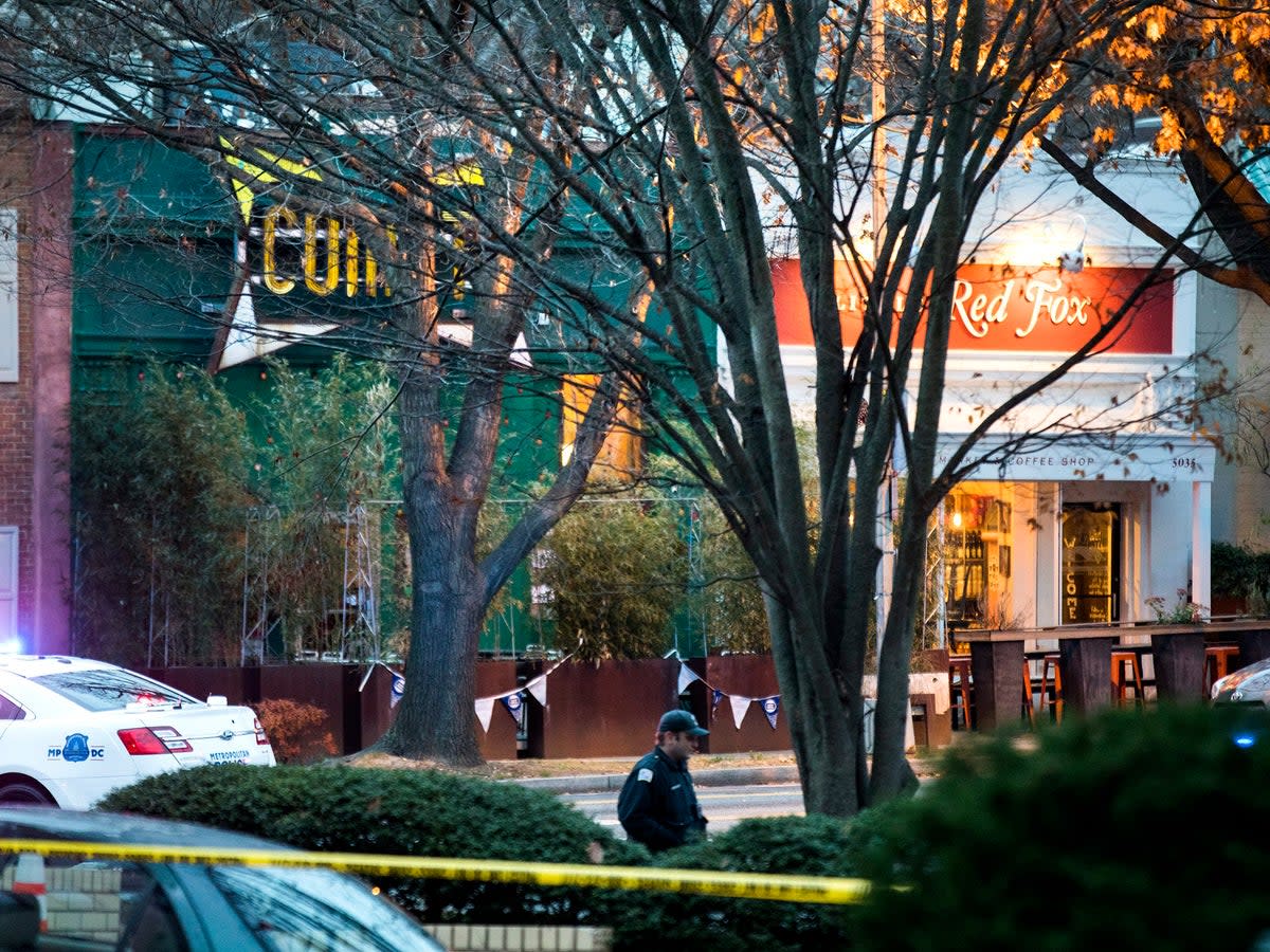 Police surround Comet Ping Pong after a man with an assault rifle entered the restaurant in Washington, DC (EPA)